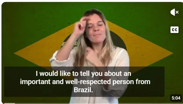 Frame de vídeo em língua de sinais do canal Frontrunners apresentando Antônio Campos de Abreu ao público internacional, com legenda em inglês.